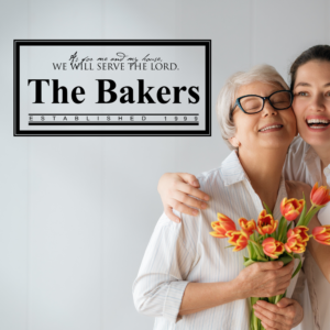 Mother and daughter hugging next to their simple stencil wall decal display that was custom made for their family. 