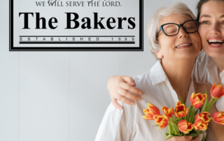 Mother and daughter hugging next to their simple stencil wall decal display that was custom made for their family.