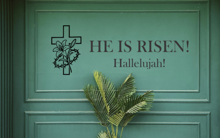 Large 'He is Risen' professional vinyl scripture decal displayed prominently on a church sanctuary wall for Easter worship.