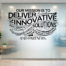 Custom mission statement wall decal displayed on lobby wall - creative custom design created by The Simple Stencil for easy decal install that is easy to apply and changeable or removable.