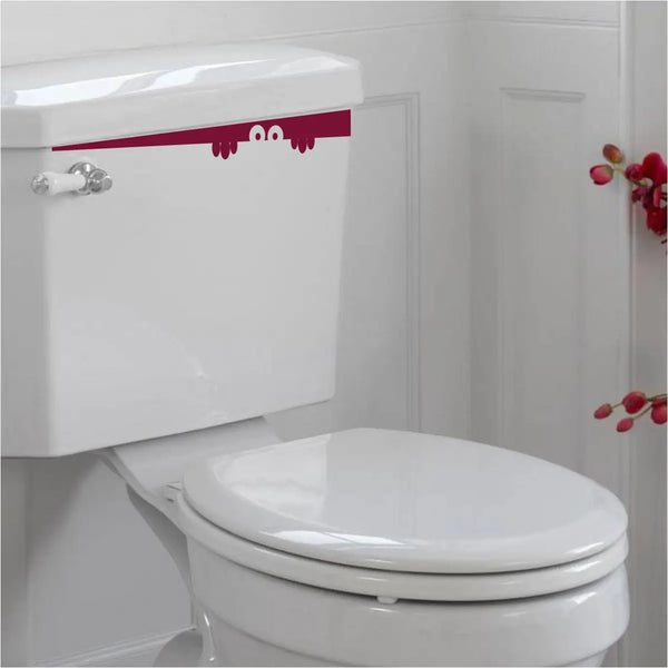Peek-a-boo eyes decal for a toilet tank